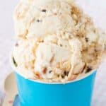 Scoops of ice cream in a blue cup with text overlay that says "Caramel Toffee No-Churn Ice Cream".