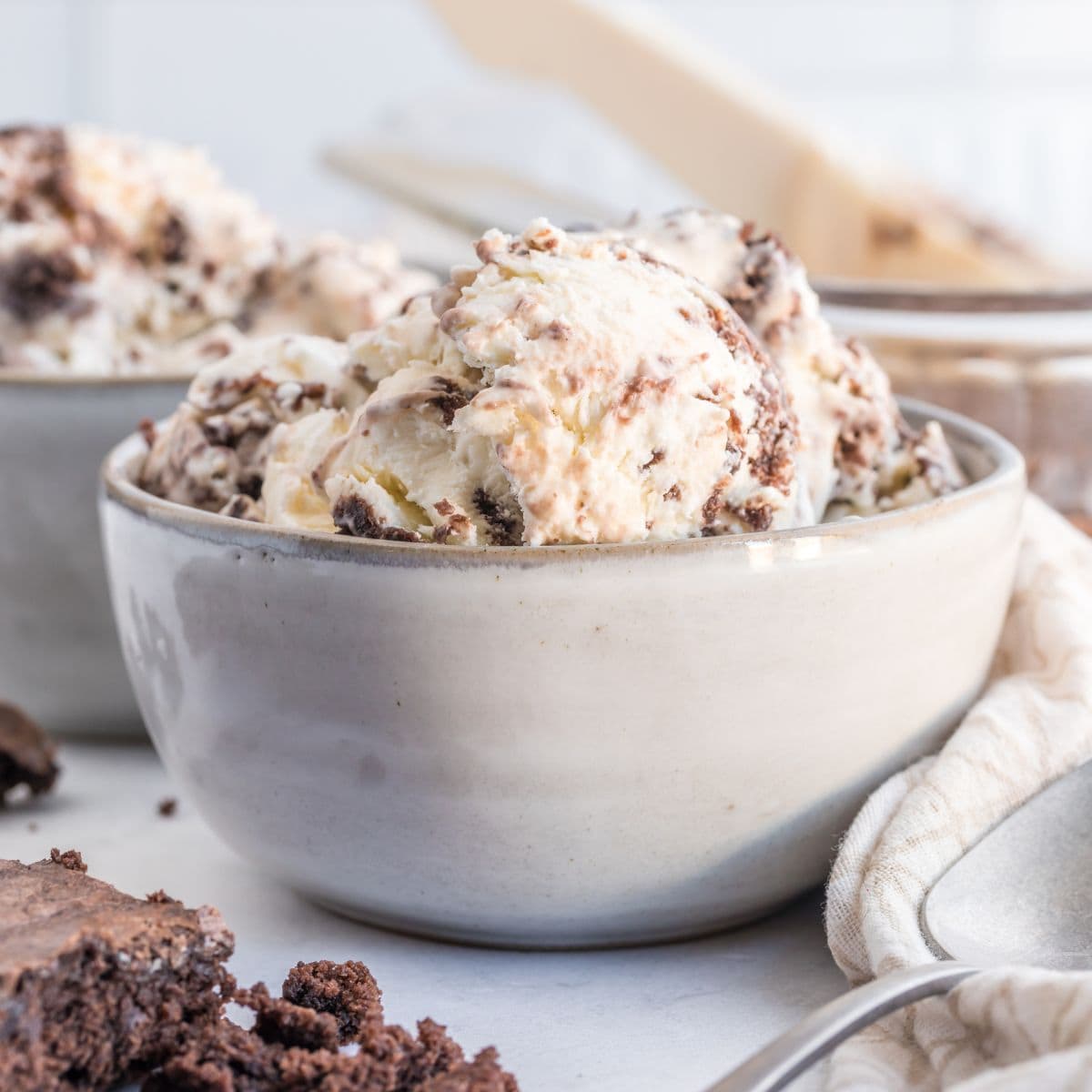 Several scoops of nutella brownie ice cream in a bowl.