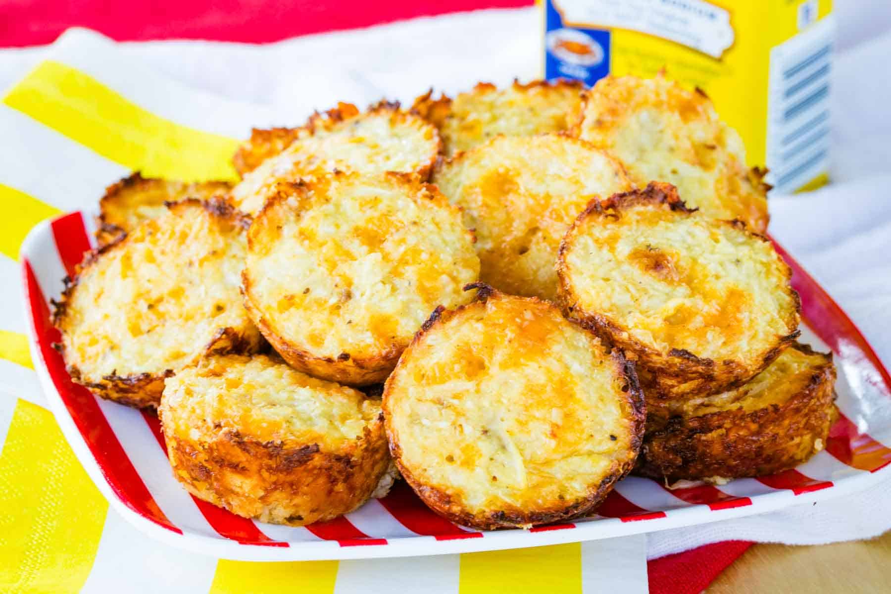 Old Bay Cauliflower Tots on a red and white striped plate.