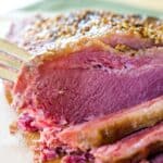 A sliced corned beef brisket on a cutting board with text overlay that says "Slow Cooker Corned Beef".