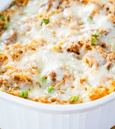 Spaghetti squash casserole in a white ceramic baking dish.