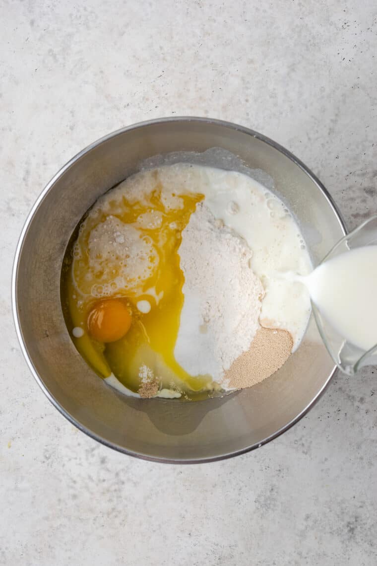 Ingredients for pastry cream are mixed in a bowl.