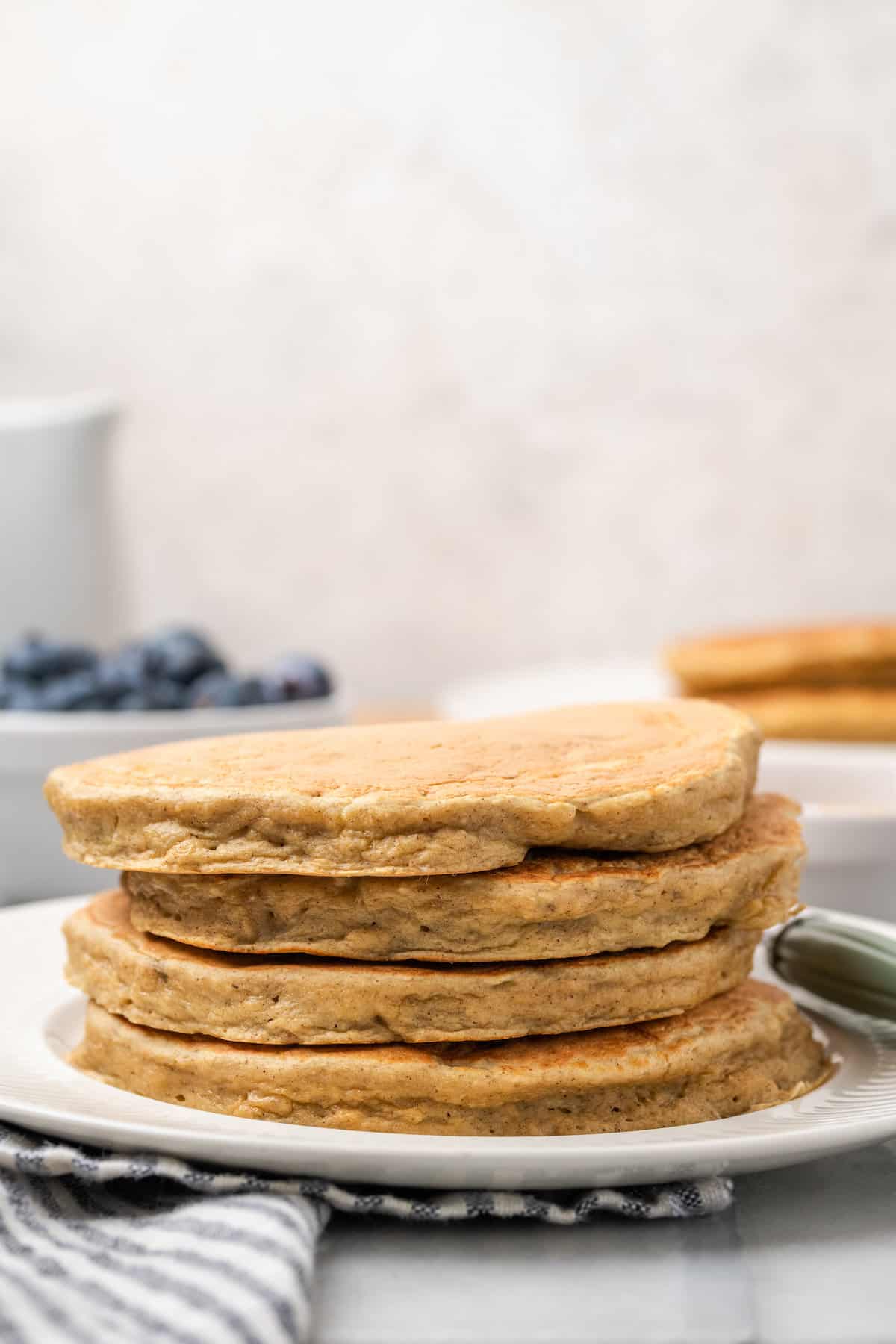 A stack of gluten-free pancakes on a plate.