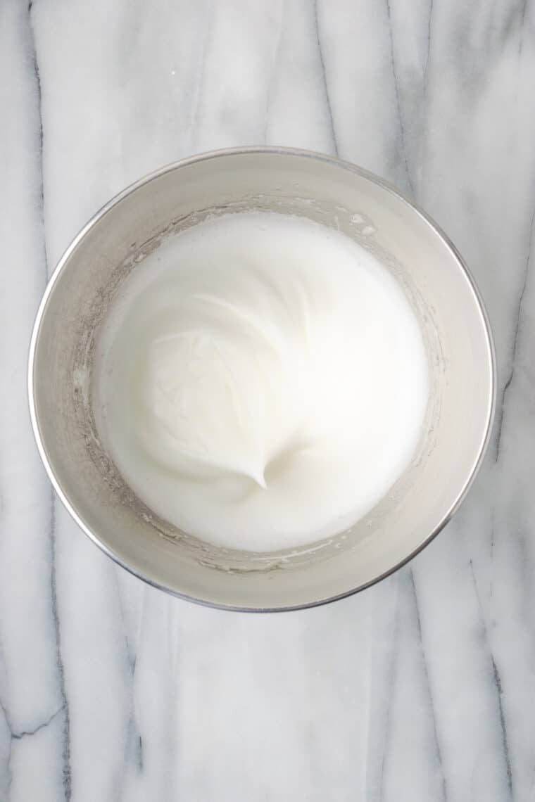 Egg whites are whipped into meringue.