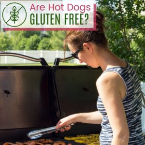 A woman holding tongs over a grill with text overlay that says "Are Hot Dogs Gluten Free?".