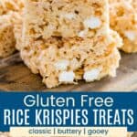 A stack of three rice krispie treats and several spread out on a wooden board divided by a blue box with text overlay that says "Gluten Free Rice Krispies Treats" and the words classic, buttery, and gooey.