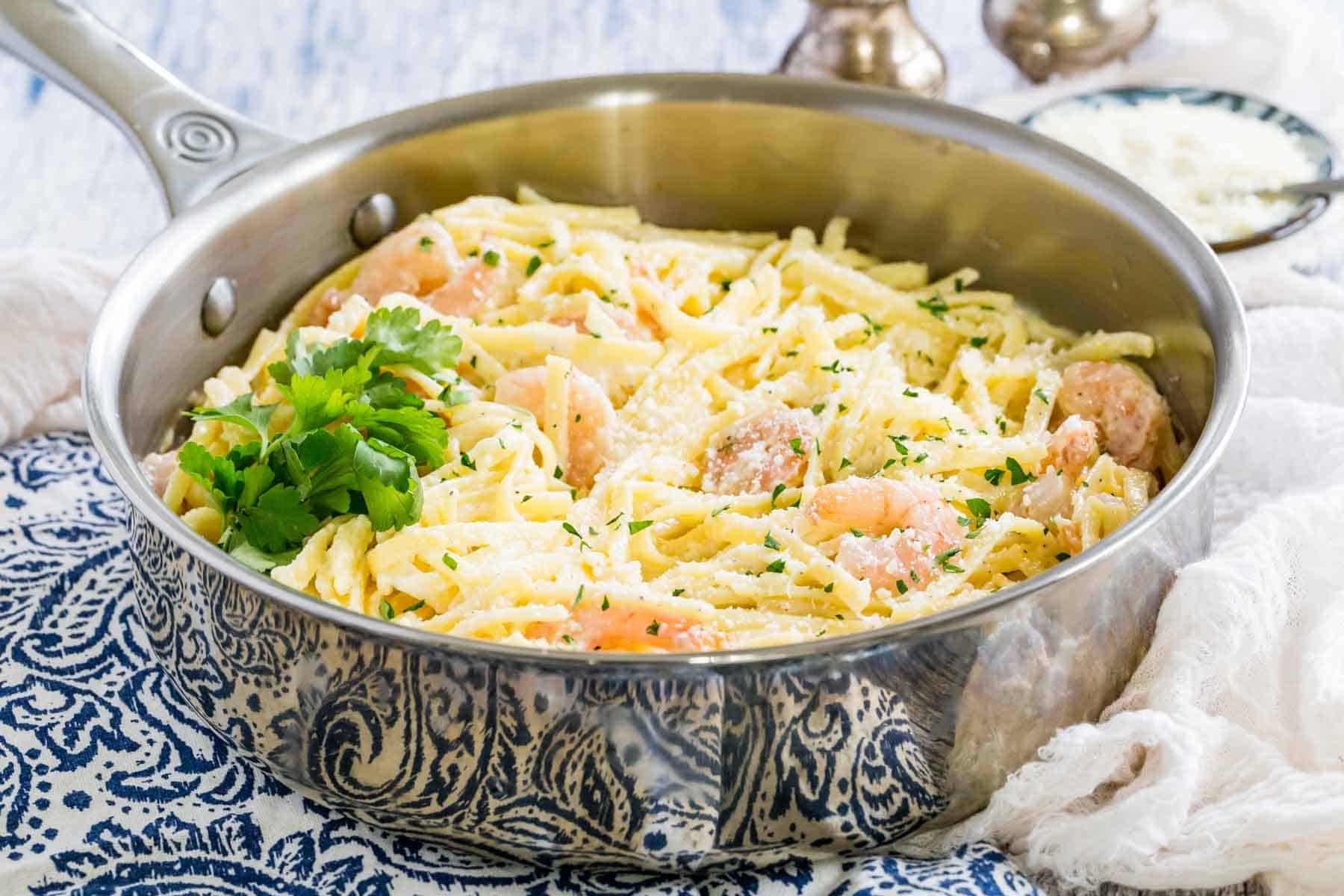 A skillet of gluten-free shrimp alfredo.