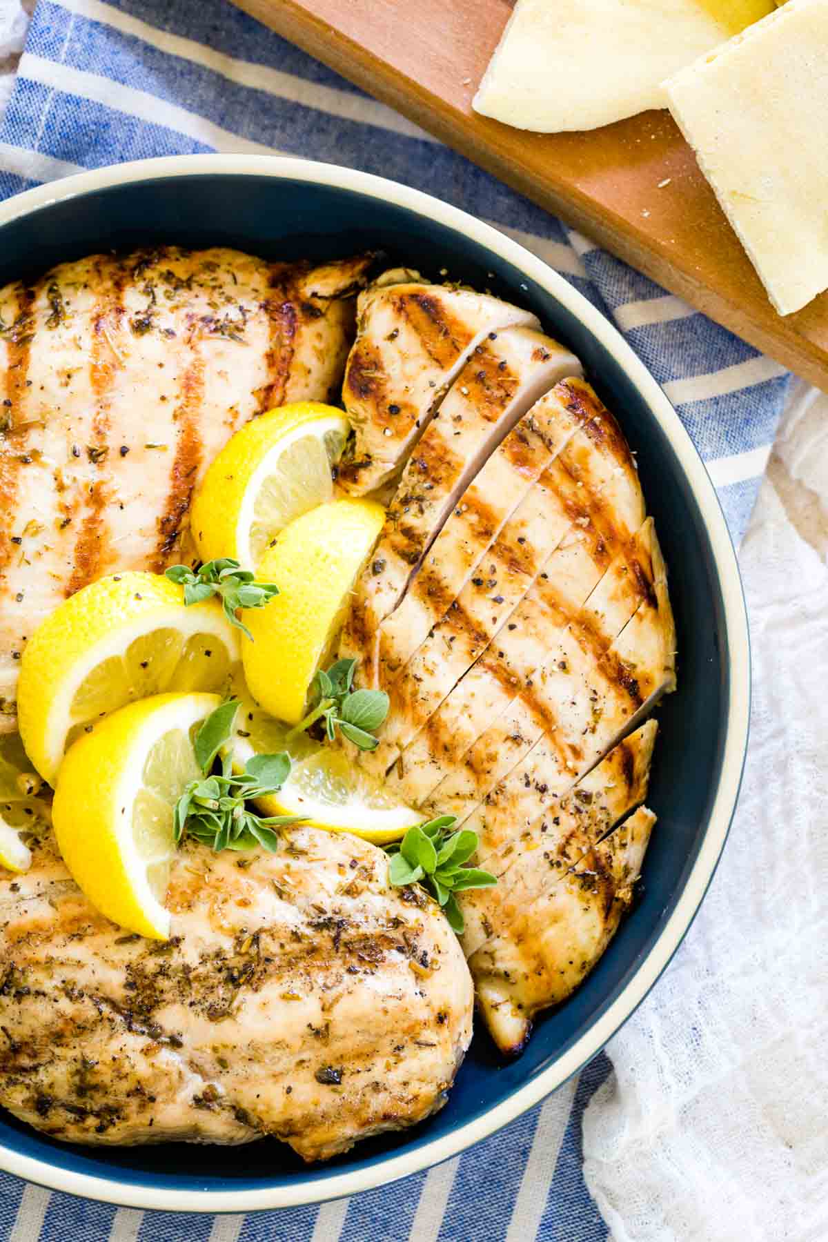 Grilled chicken with lemon in a bowl.