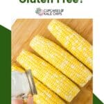 A photo of salt being shaken onto raw ears of corn on the cob on a green and white background with text overlay that says "Is Corn Gluten Free?".