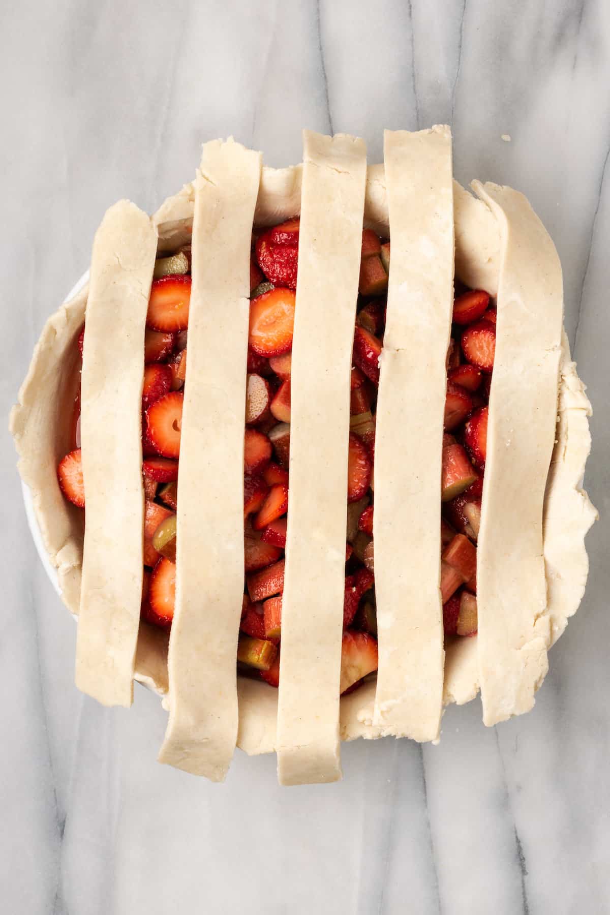 Weaving a lattice crust for pie.