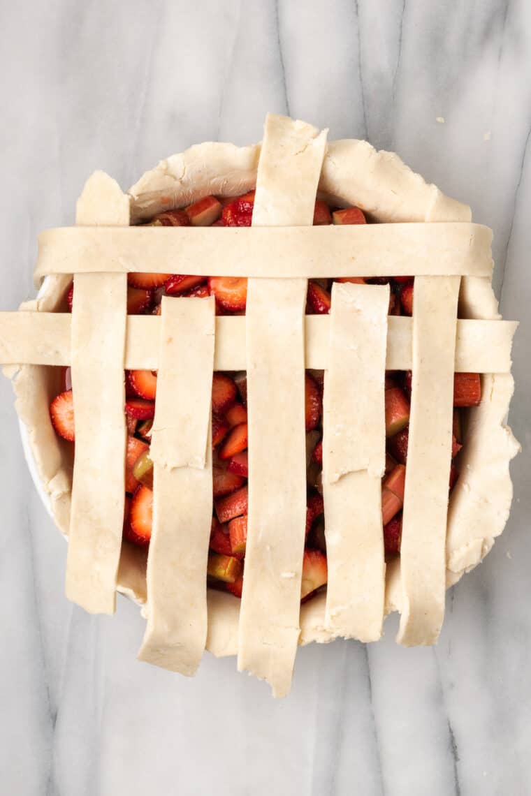 Weaving a lattice crust for pie.