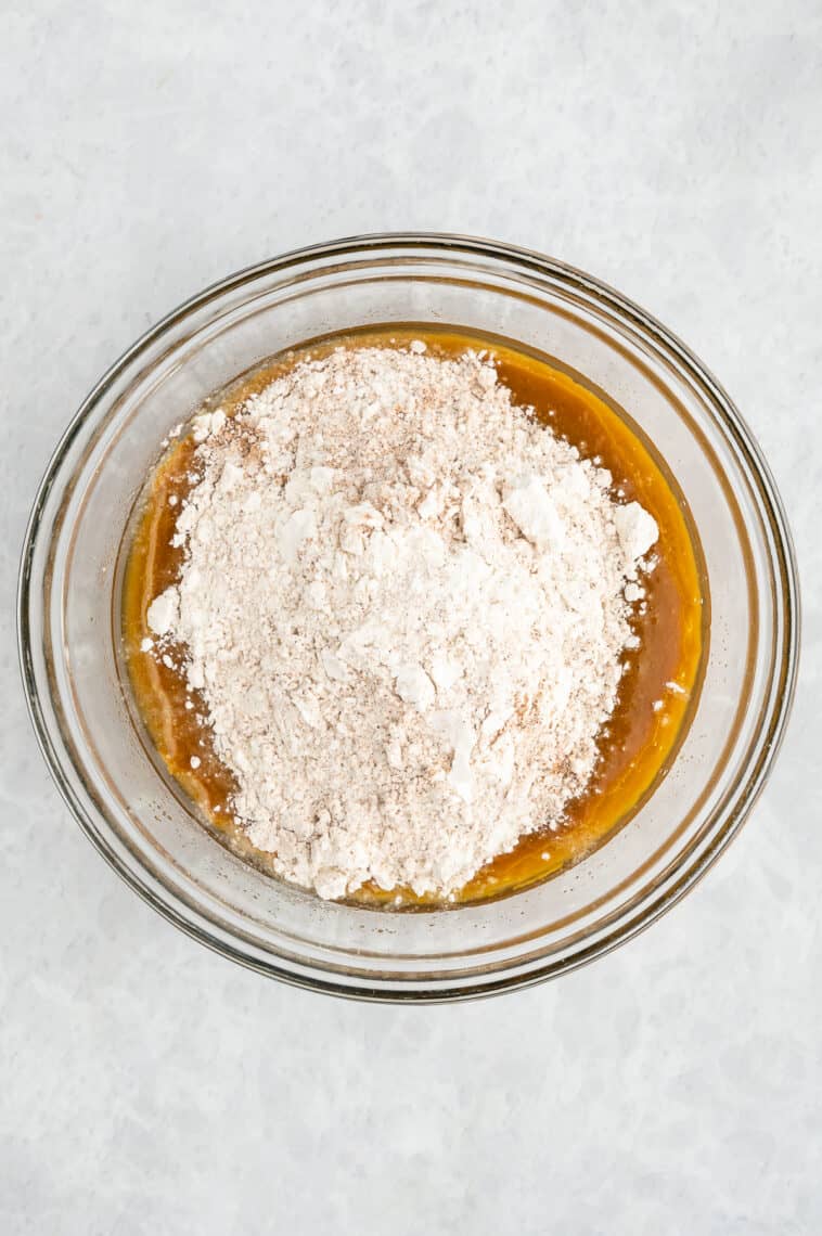 Dry ingredients are added to the pumpkin mix.
