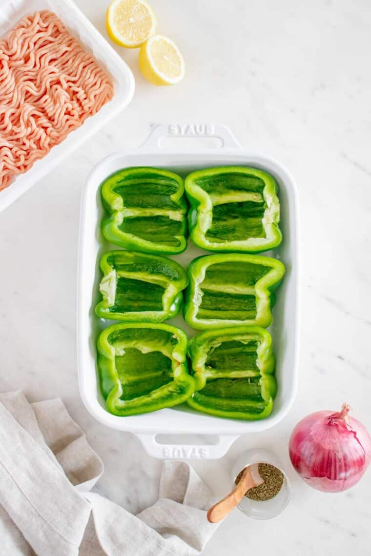 Green peppers hollowed out for stuffed peppers.