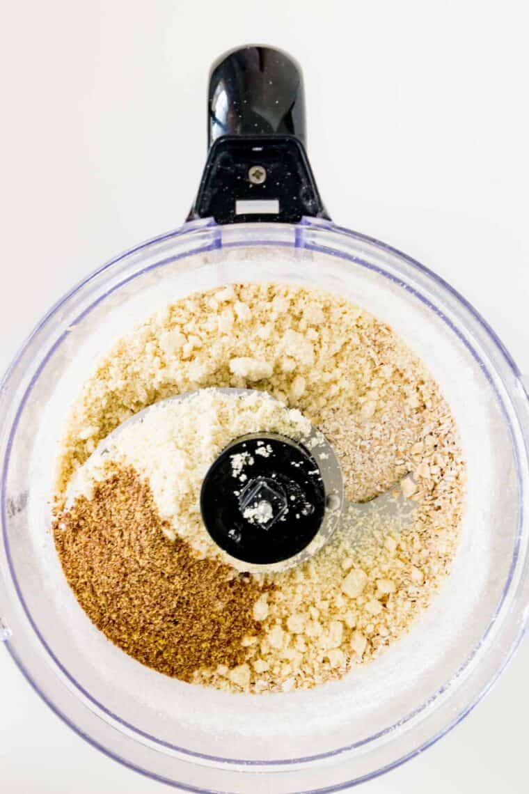 Spices, almond flour, and oats in a food processor.
