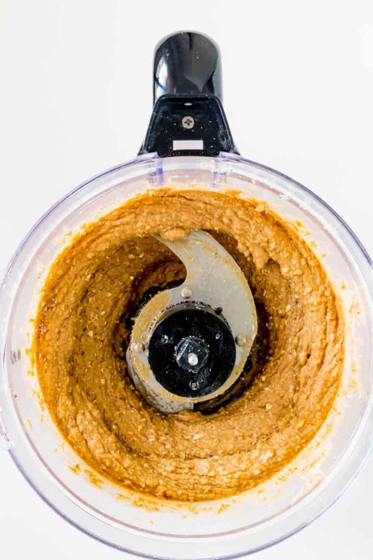Peanut butter batter for buckeyes is shown in a food processor.