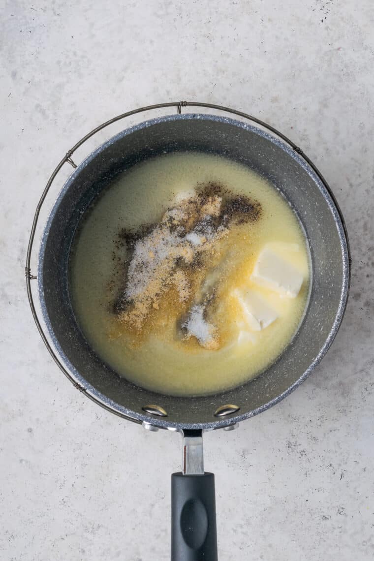 Melting butter to make soup in a pot.