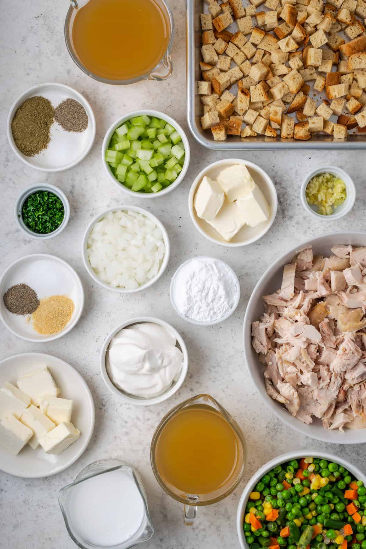 Ingredients for chicken stuffing casserole - chicken, cornstarch, vegetables, bread, milk. seasonings, sour cream.