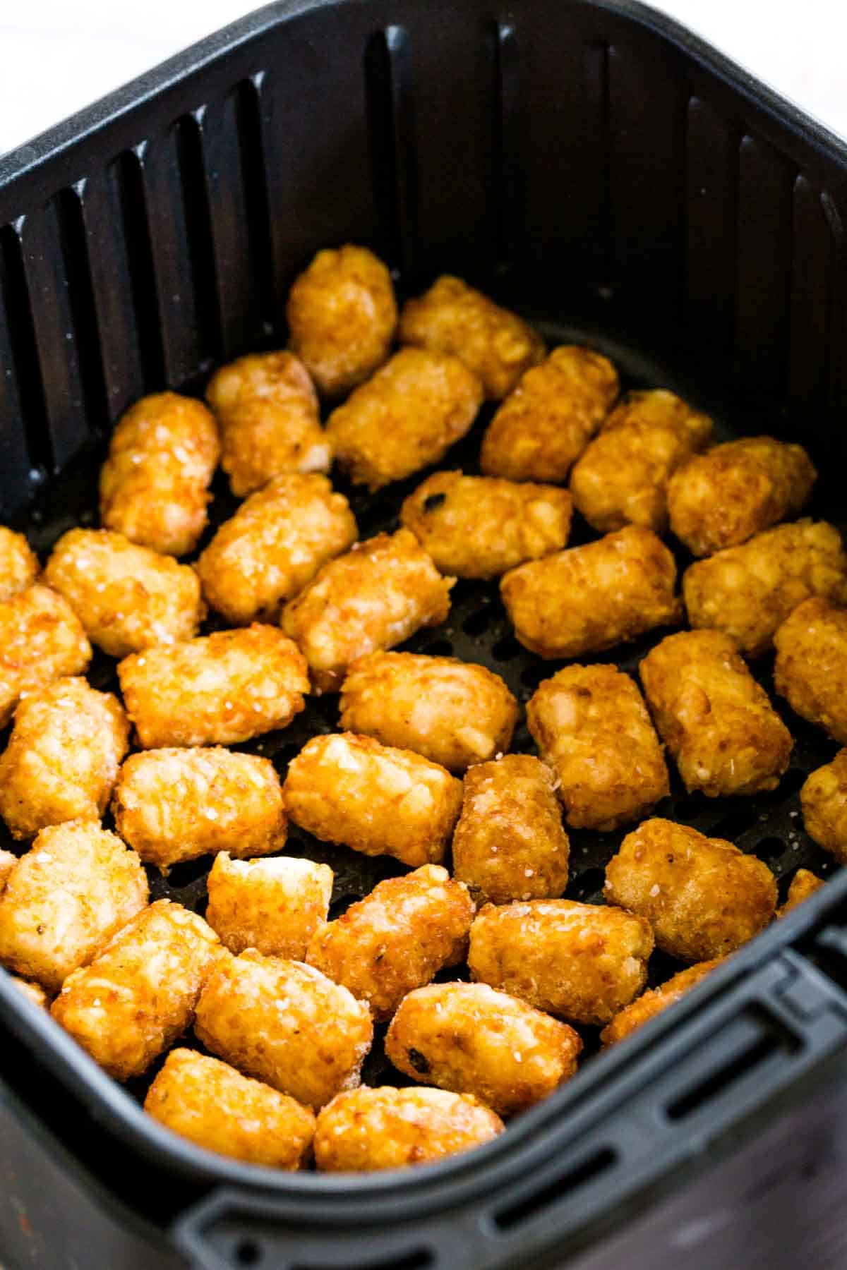 Tater tots cook in an air fryer.