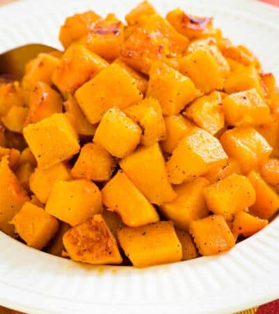 A white bowl of roasted butternut squash.