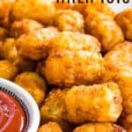 Cooked tater tots piled up next to a small dish of ketchup with text overlay that says "Air Fryer Tater Tots"