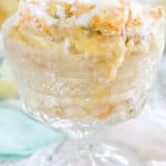 A portion of homemade banana pudding is shown in a glass.