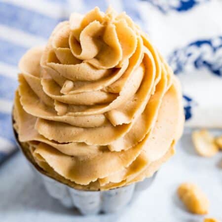 A perfect piped swirl of peanut butter frosting.