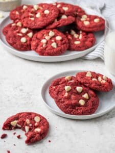 A plate and a platter holds gluten free red velvet cookies.