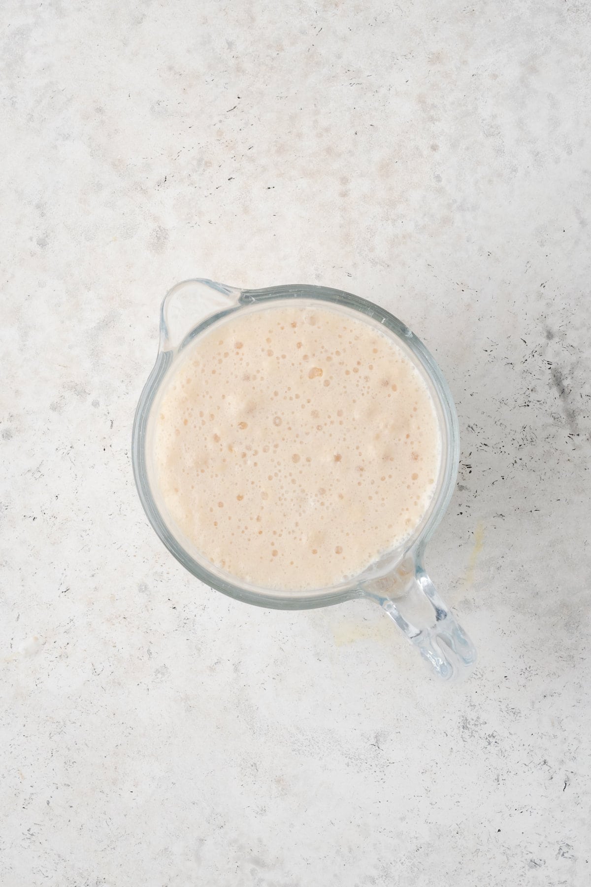 An overhead shot of activated yeast and milk.