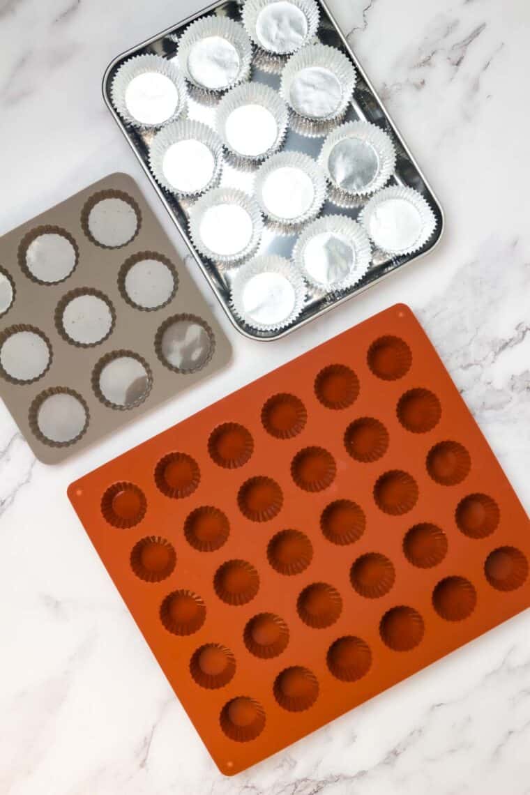Three kinds of options for making peanut butter cups are shown: silicon muffin pan, metal cup pan, paper cups.