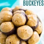 Buckeye balls piled in a bowl with text overlay that says "Healthier Peanut Butter Buckeyes".