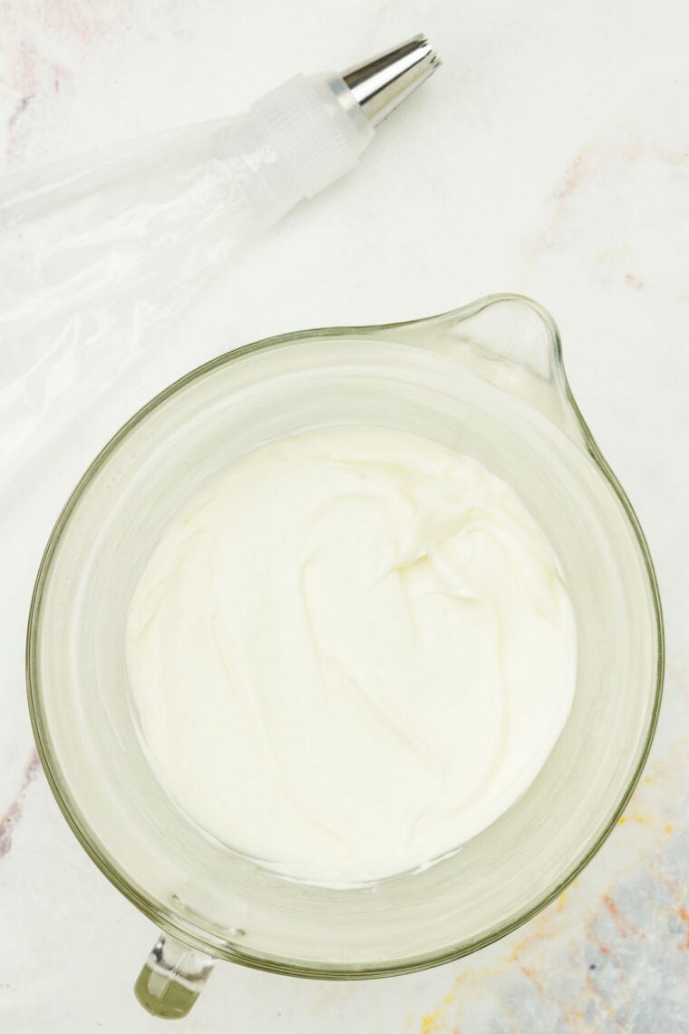 A bowl of cream cheese frosting.