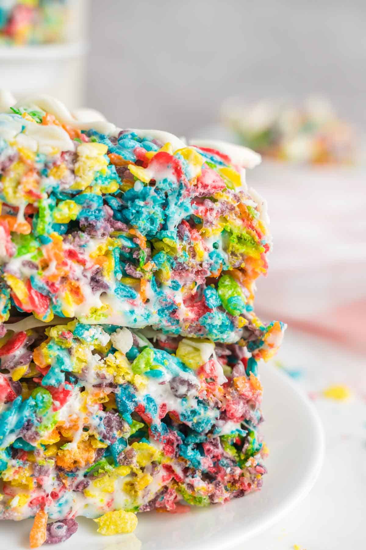 Two fruity pebbles treats stacked on top of each other are shown in a side view.