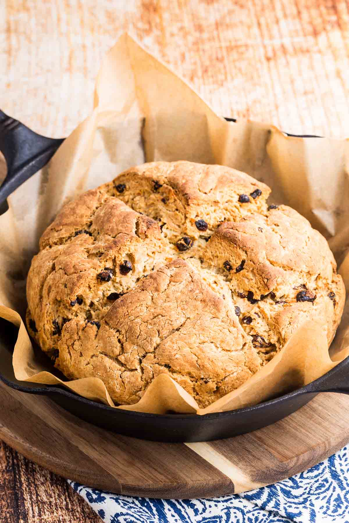 The baked Irish soda bread loaf rests in the pan.