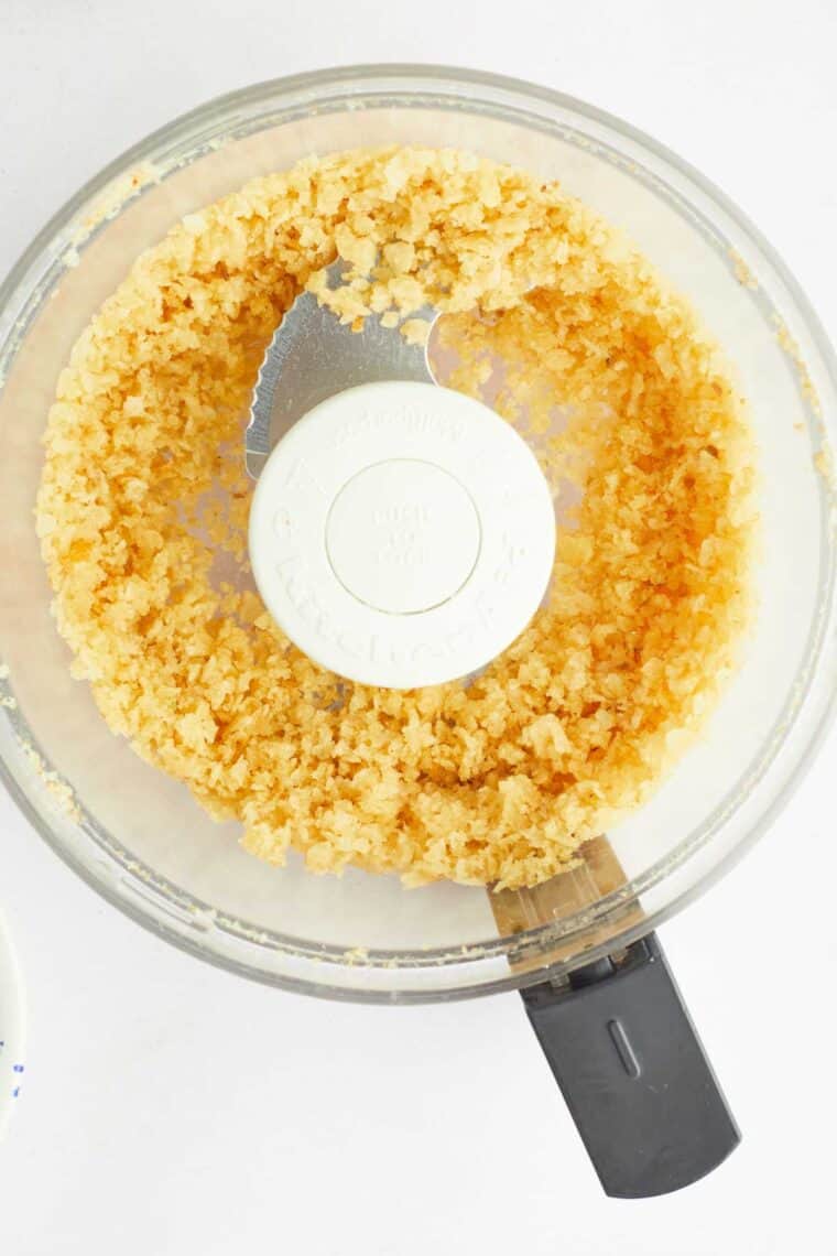 Crushed potato chips in a food processor.