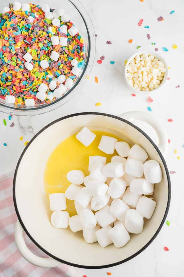 Marshmallows are added to melted butter.
