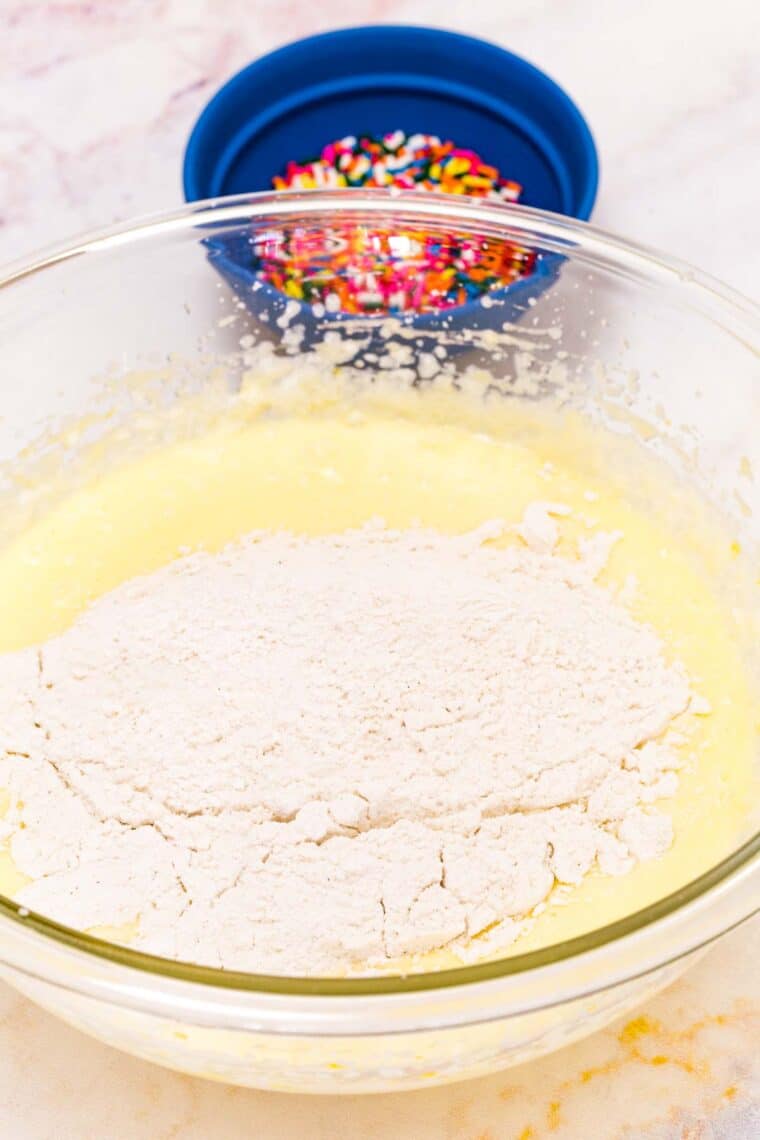 Flour is added to the wet mix.