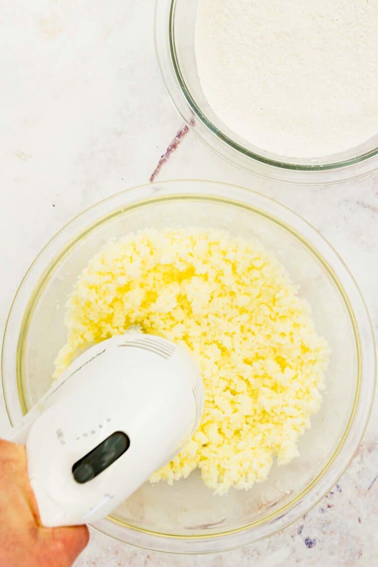 A hand mixer cream the butter and sugar.