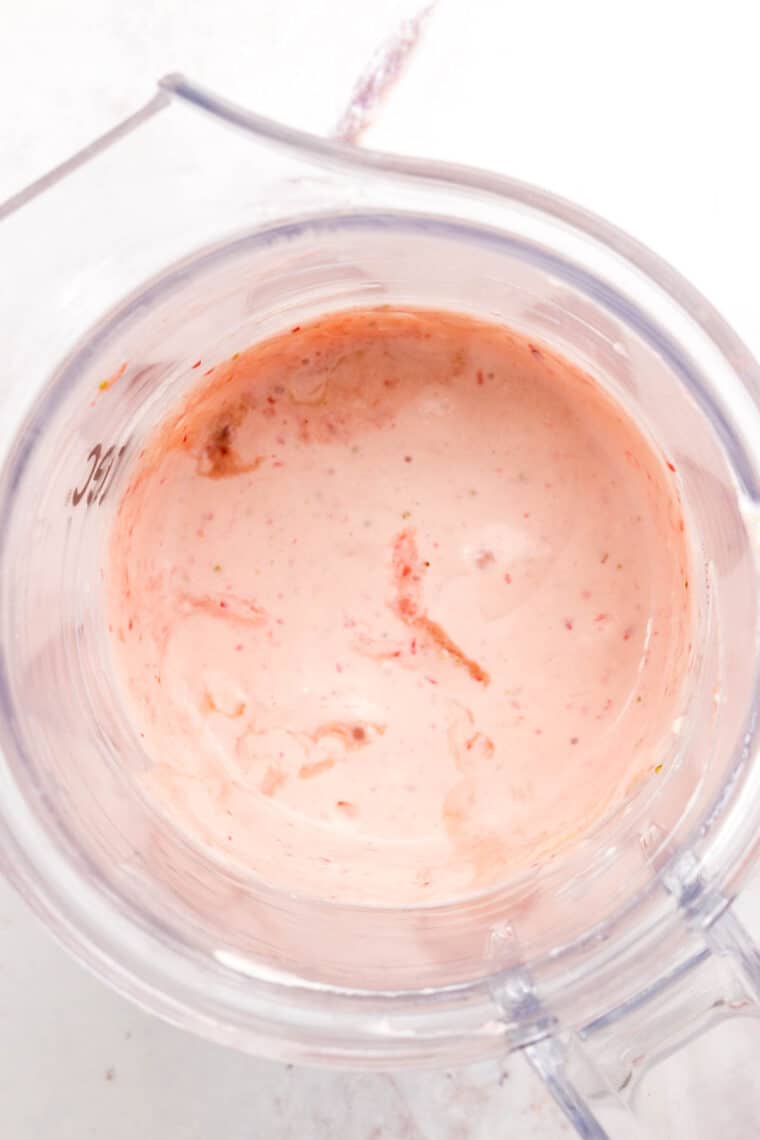 Pureed strawberries are shown in a blender.