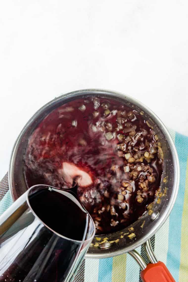 Wine is poured into the pan.