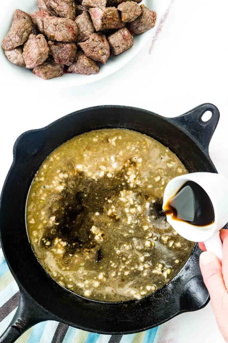 Worcestershire sauce is poured into the pan.