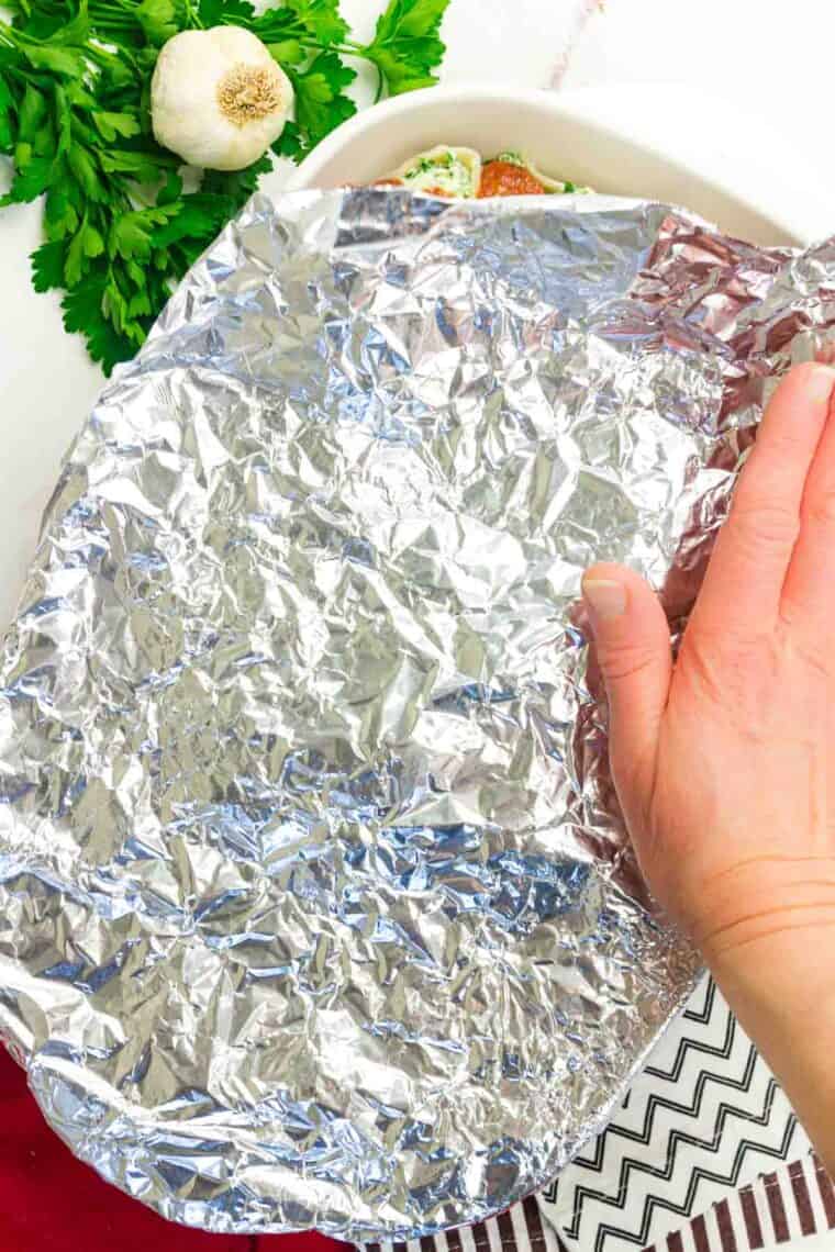A sheet of tin foil is added to the top of the pan.
