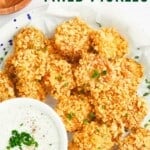 A platter of potato chip-crusted pickle slices with a bowl of dip with text overlay that says "Air Fryer Fried Pickles".