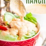 Spicy Ranch Dressing being dripped off a spoon onto a bowl of salad with text overlay that says "Buffalo Ranch".
