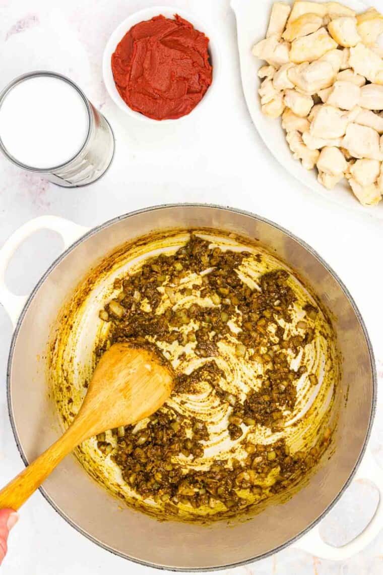 Spices are stirred in a pot for curry.