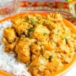 Quick chicken curry tops a bowl of white rice.