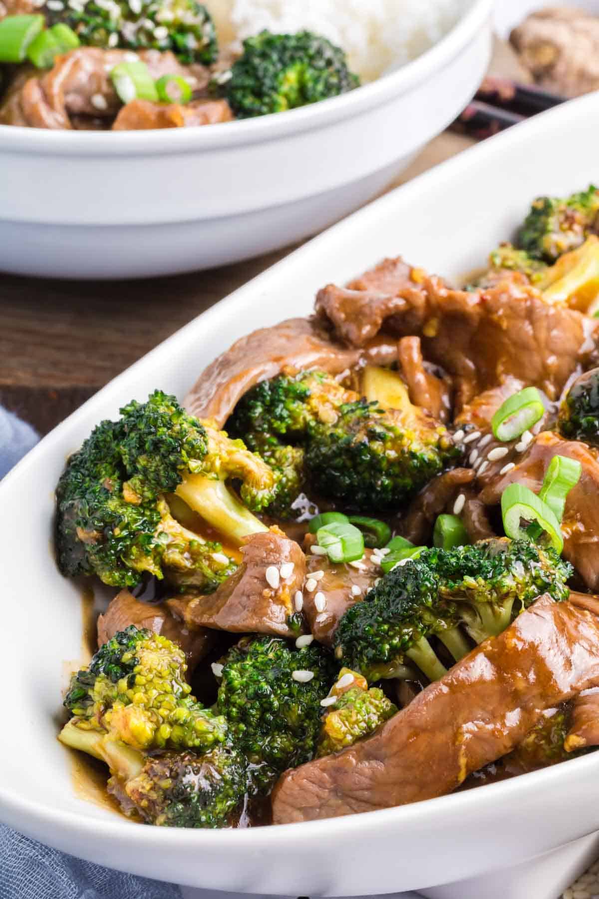 Cooked broccoli florets are shown in a dish of beef and broccoli stir fry.