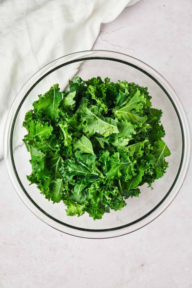 Pieces of kale ina glass bowl.