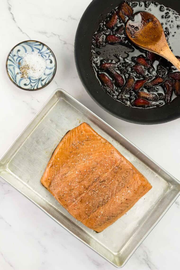 A big piece of salmon waits for glaze to be added.