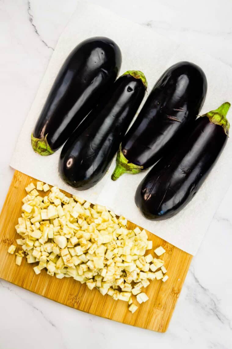 The cubed eggplant on a cutting board.