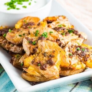 A platter of crispy smashed potatoes.